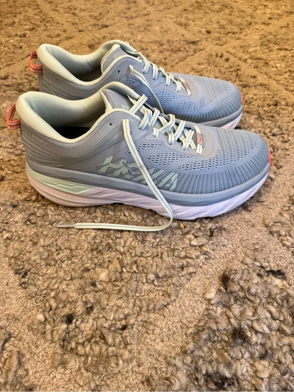 Hoka Pale Gray Running Shoes with orange Accents